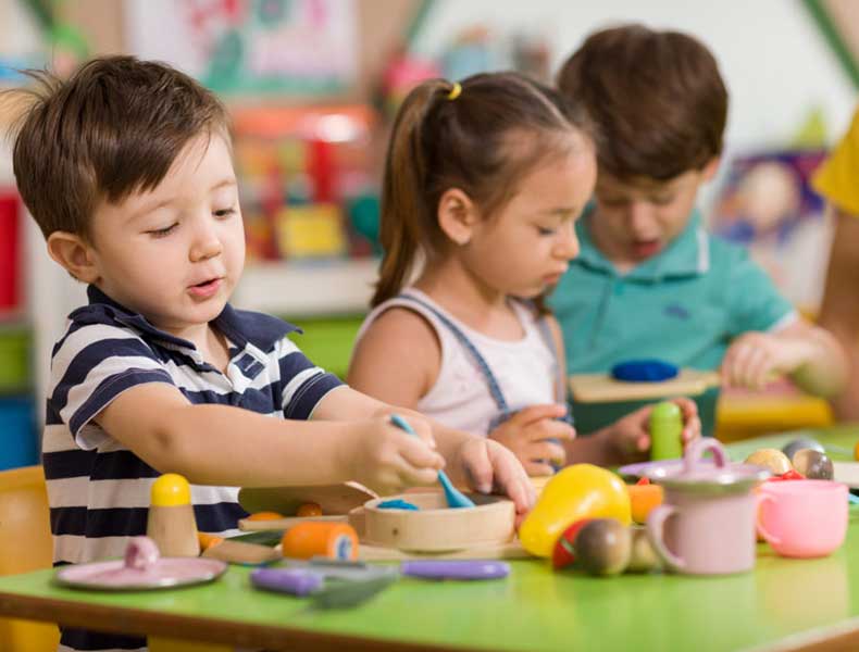 Preschoolers learning together in the classroom
